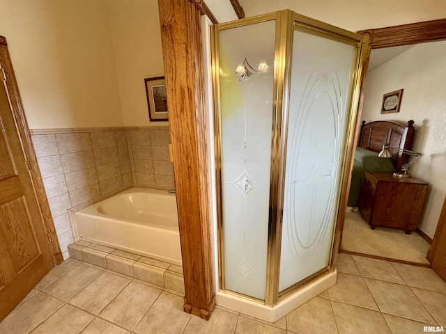 bathroom with plus walk in shower and tile patterned flooring