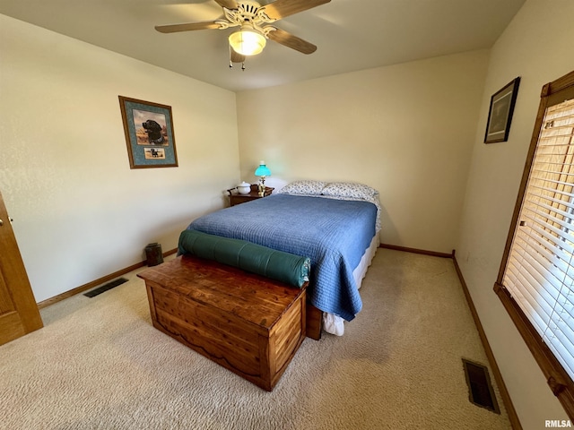 bedroom featuring light colored carpet and ceiling fan