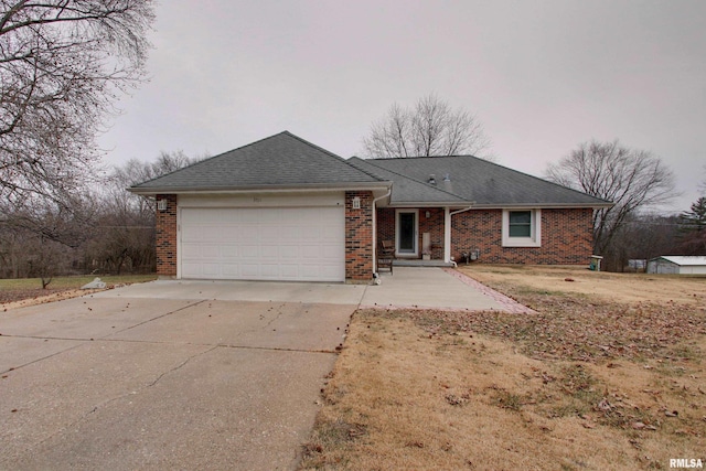 ranch-style home featuring a garage