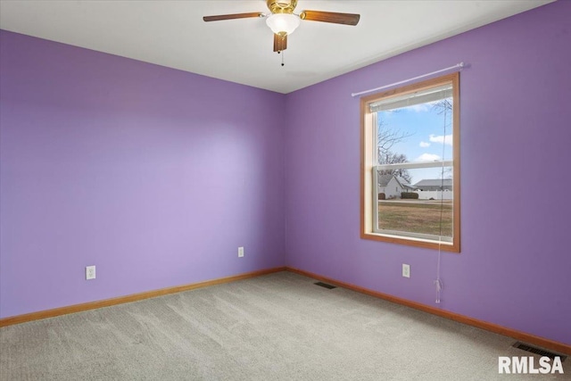 unfurnished room featuring carpet floors and ceiling fan