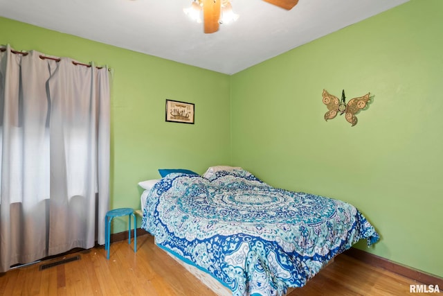 bedroom featuring ceiling fan and hardwood / wood-style floors