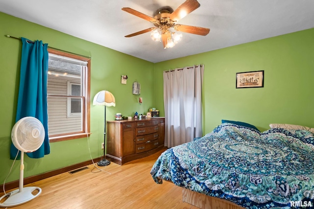 bedroom featuring light hardwood / wood-style flooring and ceiling fan