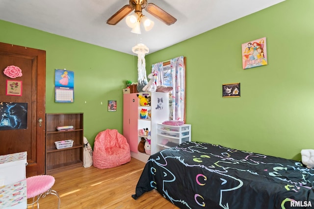 bedroom featuring ceiling fan and light hardwood / wood-style floors