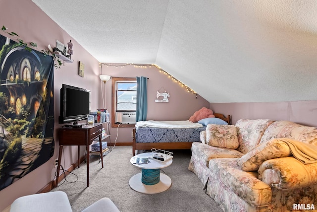 carpeted bedroom with cooling unit, lofted ceiling, and a textured ceiling