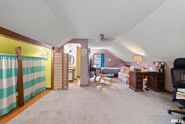 bedroom featuring carpet floors and vaulted ceiling