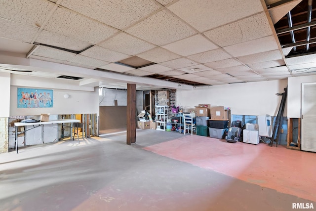 basement featuring a drop ceiling