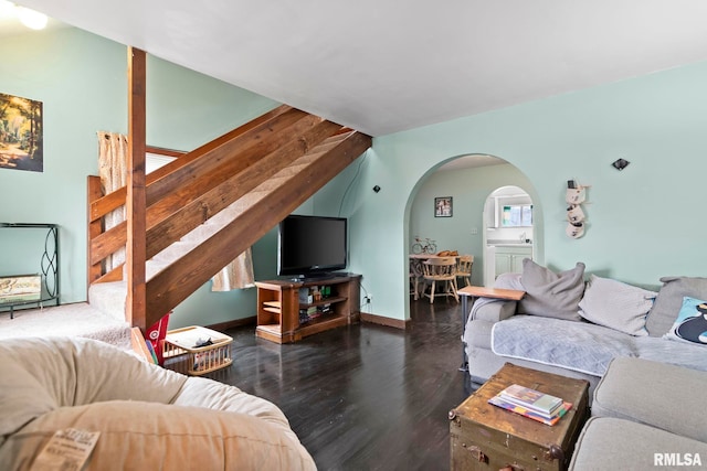 living room with dark hardwood / wood-style flooring