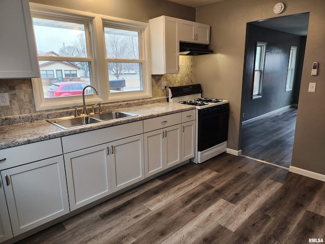 kitchen with sink, white cabinetry, dark hardwood / wood-style floors, range with gas stovetop, and backsplash