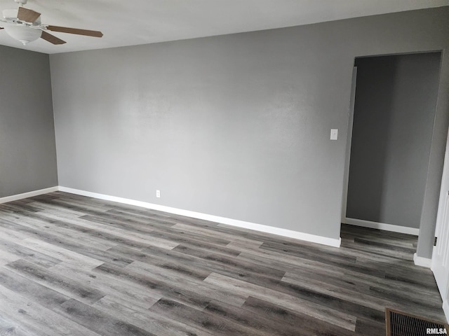 spare room featuring wood-type flooring and ceiling fan