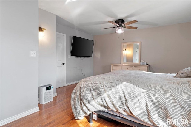 bedroom featuring ceiling fan and light hardwood / wood-style floors