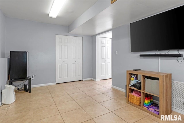 playroom with light tile patterned floors