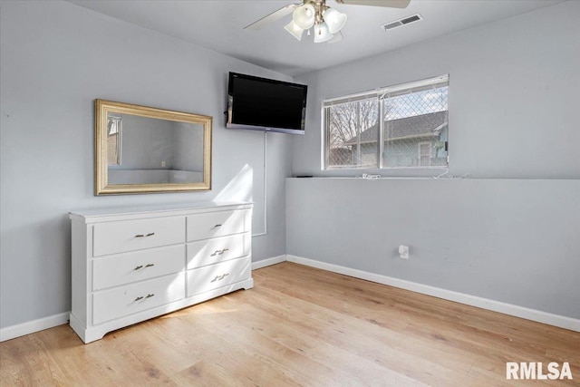 unfurnished bedroom with ceiling fan and light hardwood / wood-style floors