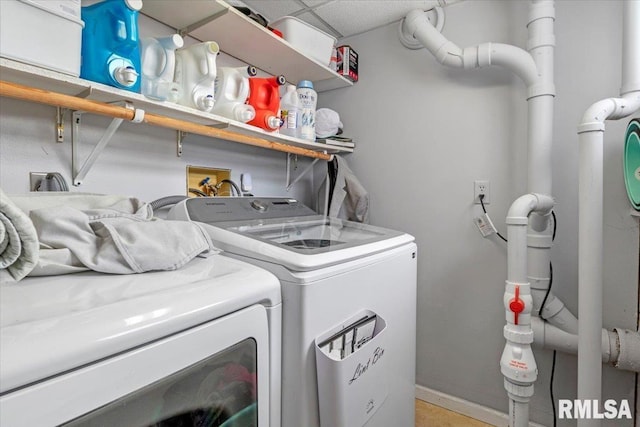 washroom featuring washer and clothes dryer