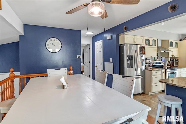 dining room featuring ceiling fan