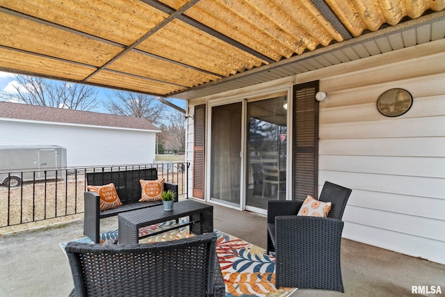 view of patio featuring a balcony