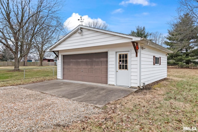 garage featuring a lawn