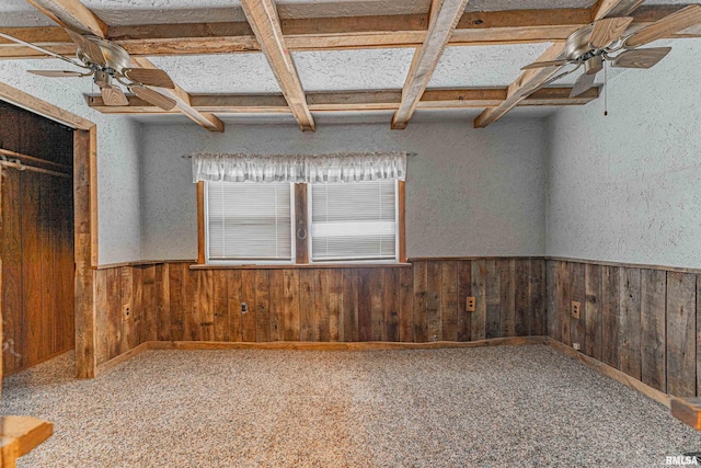 spare room featuring ceiling fan, coffered ceiling, and carpet flooring