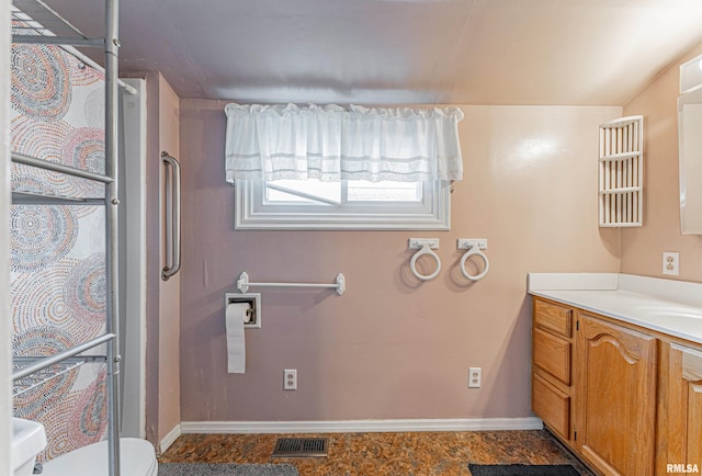 bathroom with vanity and toilet