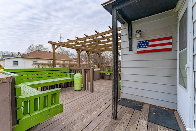 wooden deck featuring a pergola