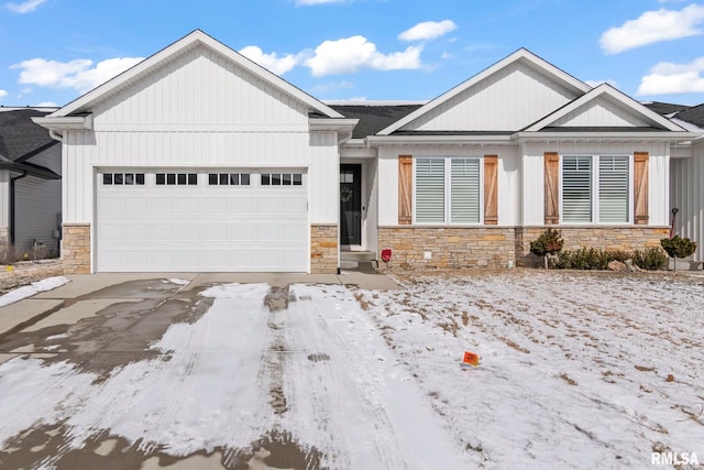 view of front of home featuring a garage, stone siding, and concrete driveway