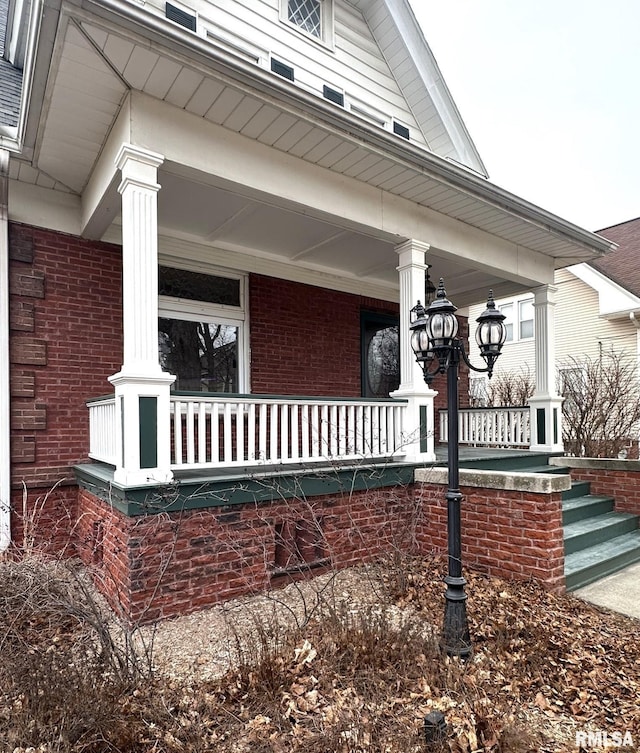 view of side of home with a porch