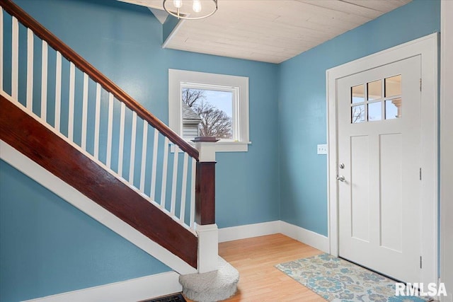 foyer with hardwood / wood-style floors and wood ceiling