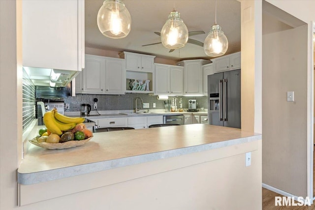 kitchen featuring white cabinetry, stainless steel appliances, sink, and tasteful backsplash