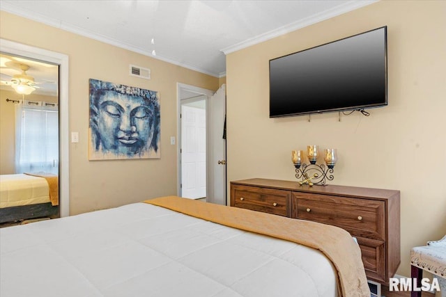 bedroom with ornamental molding