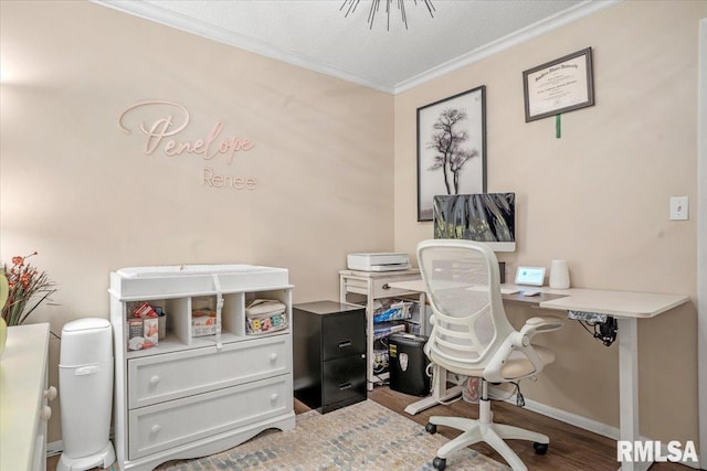 home office featuring crown molding, wood-type flooring, and a textured ceiling