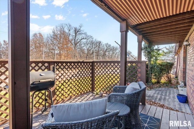 wooden terrace with a grill