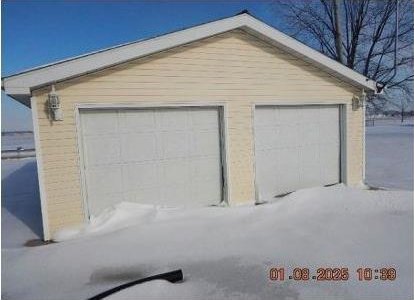 view of snow covered garage