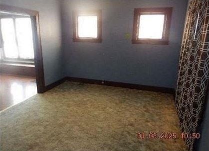 unfurnished room with carpet floors