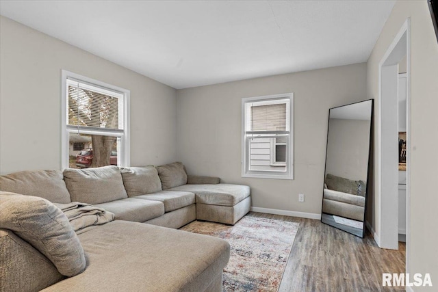 living room featuring plenty of natural light and light hardwood / wood-style floors