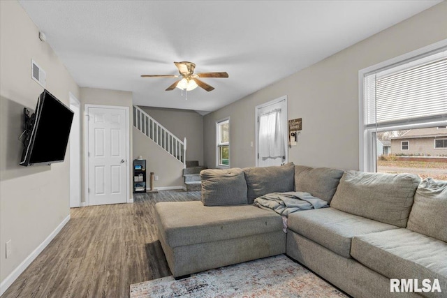 living room featuring hardwood / wood-style flooring and ceiling fan