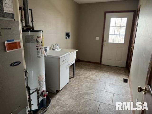 laundry room with washer hookup and gas water heater