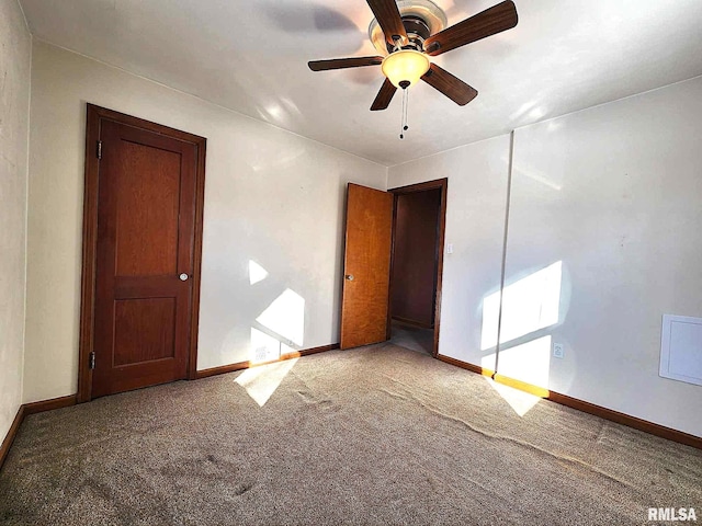 carpeted empty room with ceiling fan