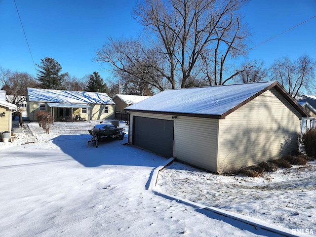 view of snow covered garage