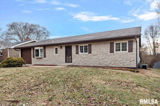 ranch-style home with a garage, central AC, and a front lawn