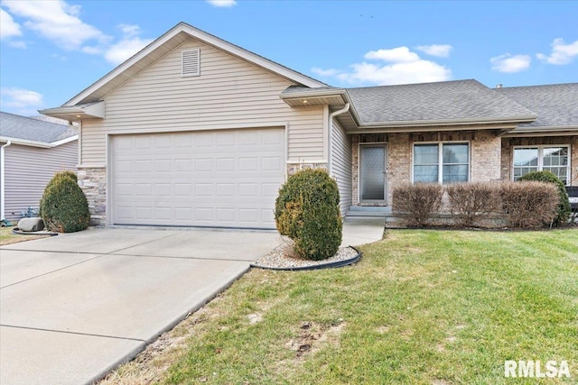 single story home featuring a garage and a front lawn