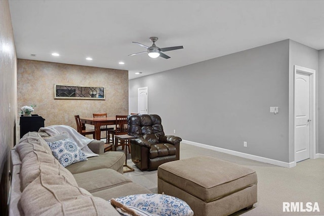 carpeted living room featuring ceiling fan