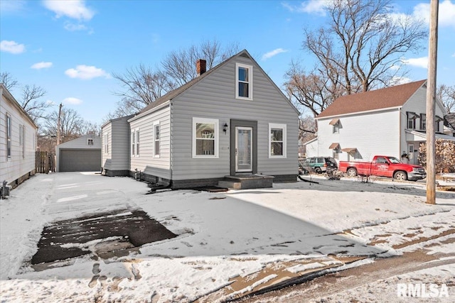 view of front facade with a garage and an outdoor structure