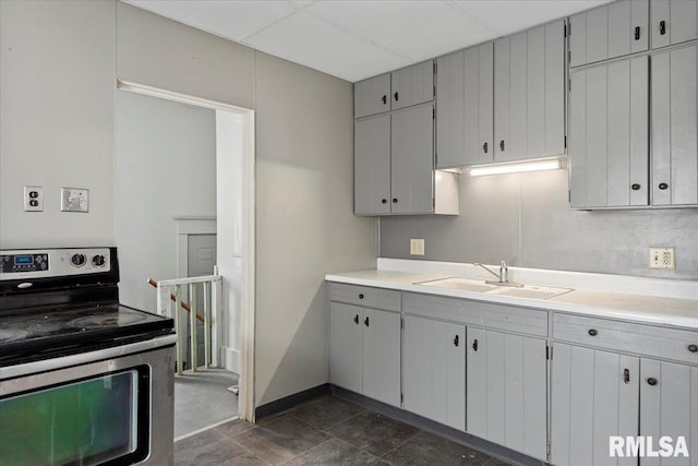 kitchen featuring electric stove and sink