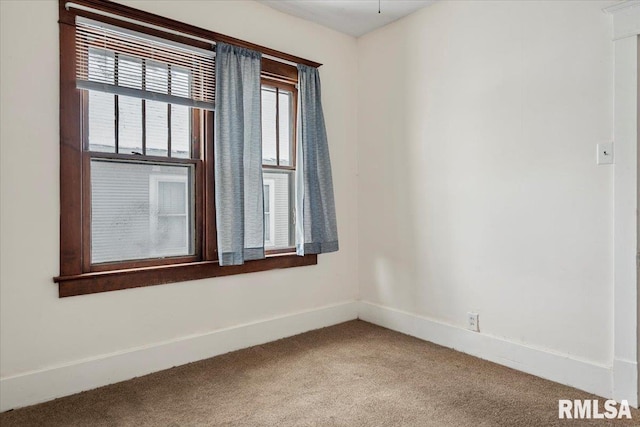 empty room featuring carpet flooring