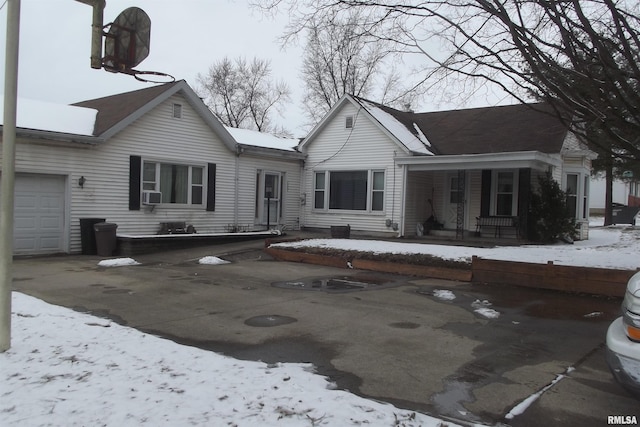 view of front of home with a garage and covered porch