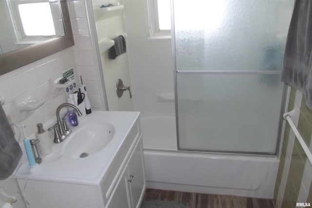 full bath featuring vanity and shower / bath combination with glass door