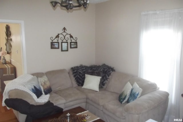 living room with a notable chandelier