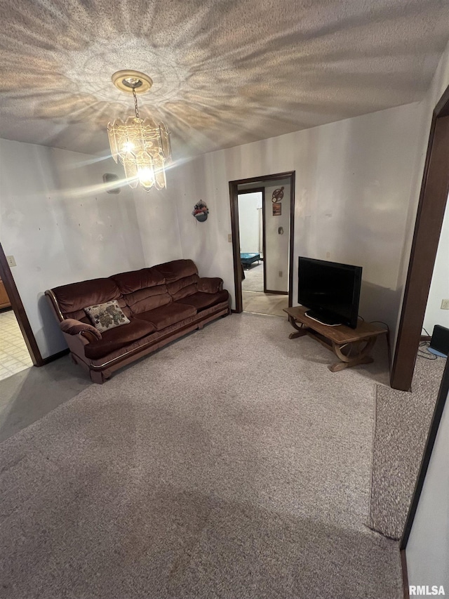 unfurnished living room featuring a notable chandelier and a textured ceiling