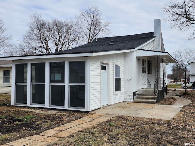 back of property with a patio