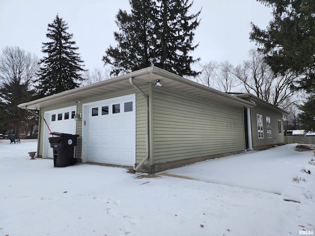 view of snow covered garage