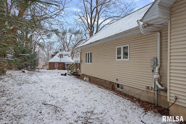 view of snow covered property